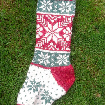 Three traditional knitted Christmas stockings