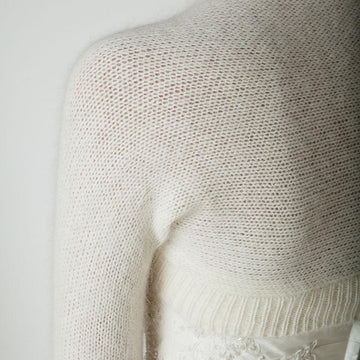 Bolero knitted in one piece