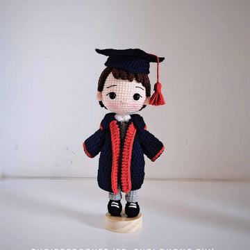 Graduation boy doll
