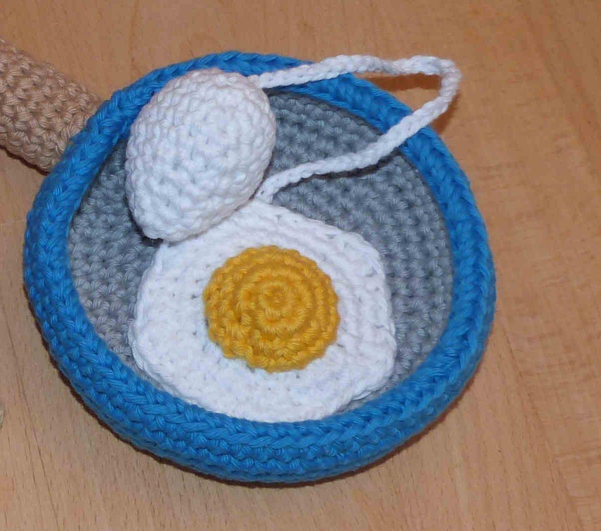 Cup and ball game: pan with eggs