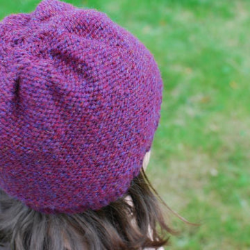 Cable embellished hat
