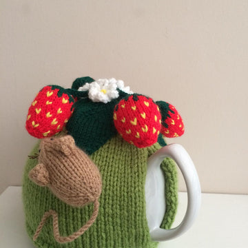 Nature tea cosy. Animal tea cosy .Pesky mouse in the strawberry patch