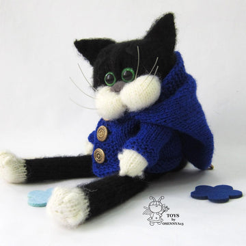 A cat is in an overcoat