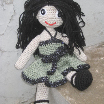 Crochet doll in olive green dress