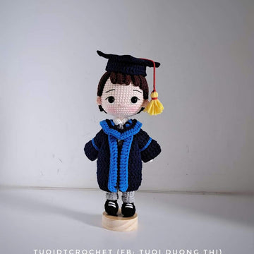 Graduation boy doll