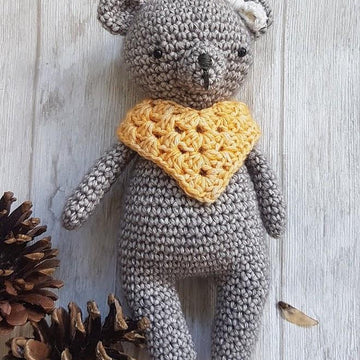 Bear with poncho and bow