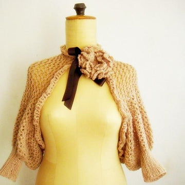 Knit lace shrug with knit flower pin