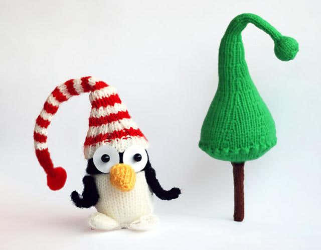 New Year Penguin in hat with Christmas tree
