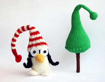 New Year Penguin in hat with Christmas tree