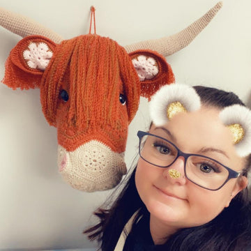 Heather the African flower highland cow head