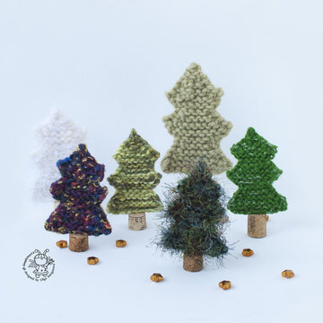 Many Christmas trees knitted flat