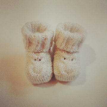 Baby booties with owl detail