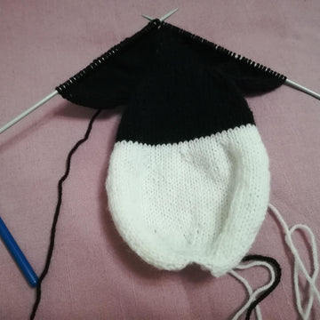 Knitting patterns for Mickey Mouse and Minnie Mouse toys based on Steamboat Willi
