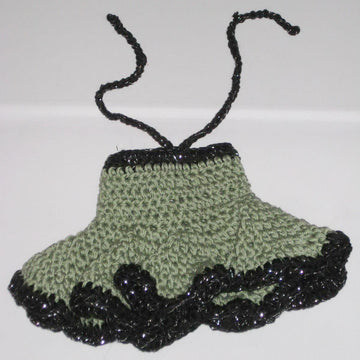 Crochet doll in olive green dress