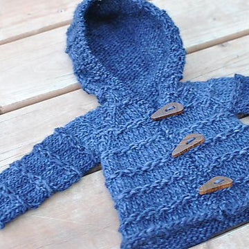 Enveloping baby cardigan