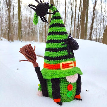Halloween witch with a broom