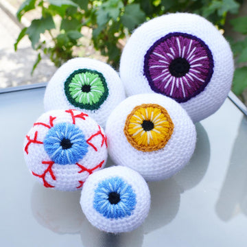 Crochet eyeballs. Creepy eyes. Halloween spooky eyes. Eyeball with blood vessels