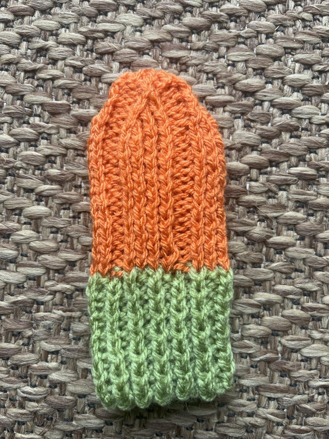 Knitted pumpkin mittens