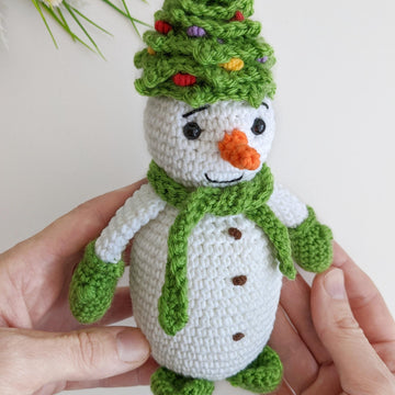 Crochet snowman in a Christmas tree hat amigurumi pattern