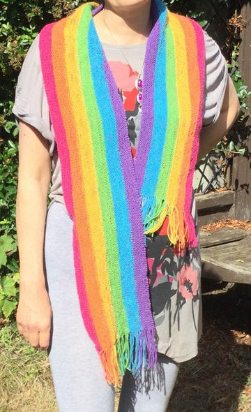 Sideways knitted rainbow scarf