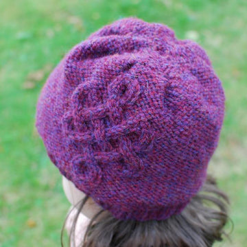 Cable embellished hat