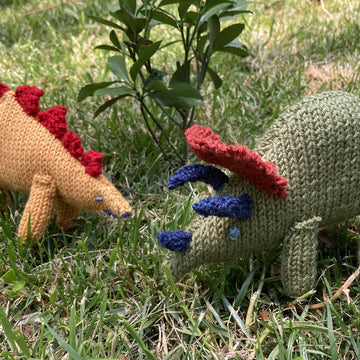 Stegosaurus and Triceratops knitted soft toys