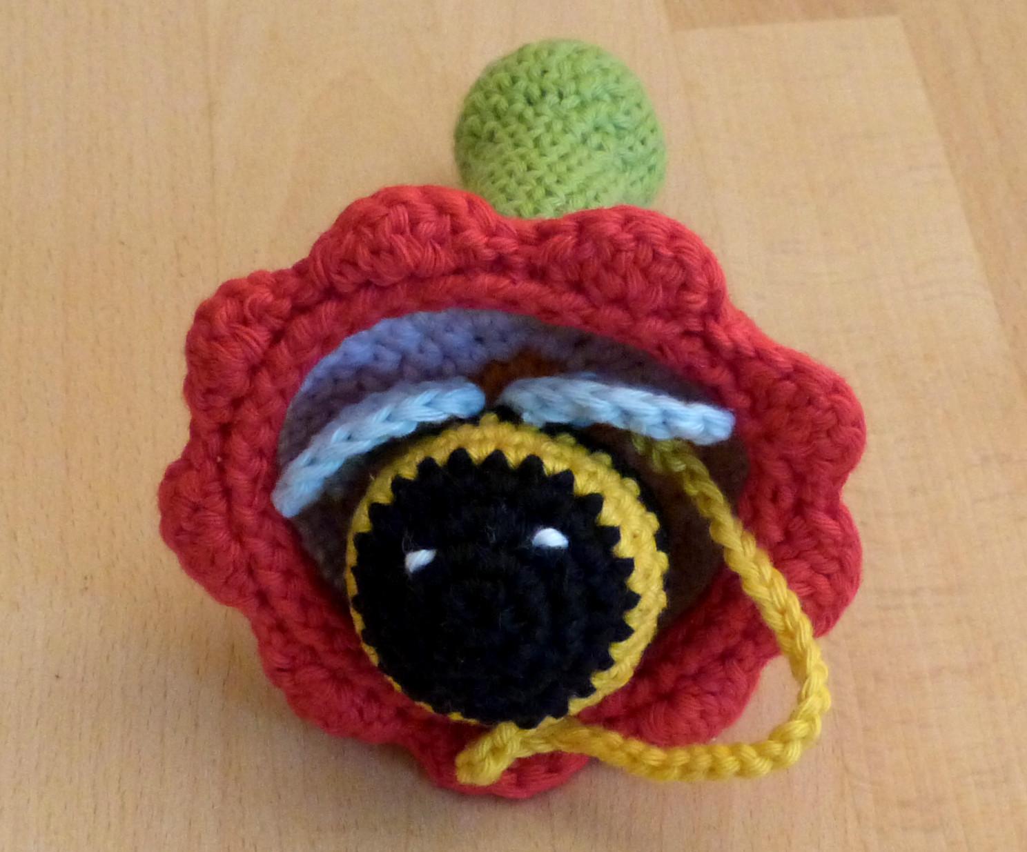 Cup and ball game: flower with bumblebee