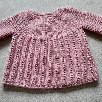 Sideways knit baby jacket