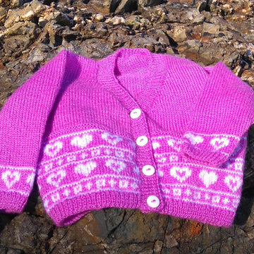 Two baby fairisle cardigans with boats and hearts