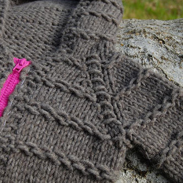 Enveloping baby cardigan